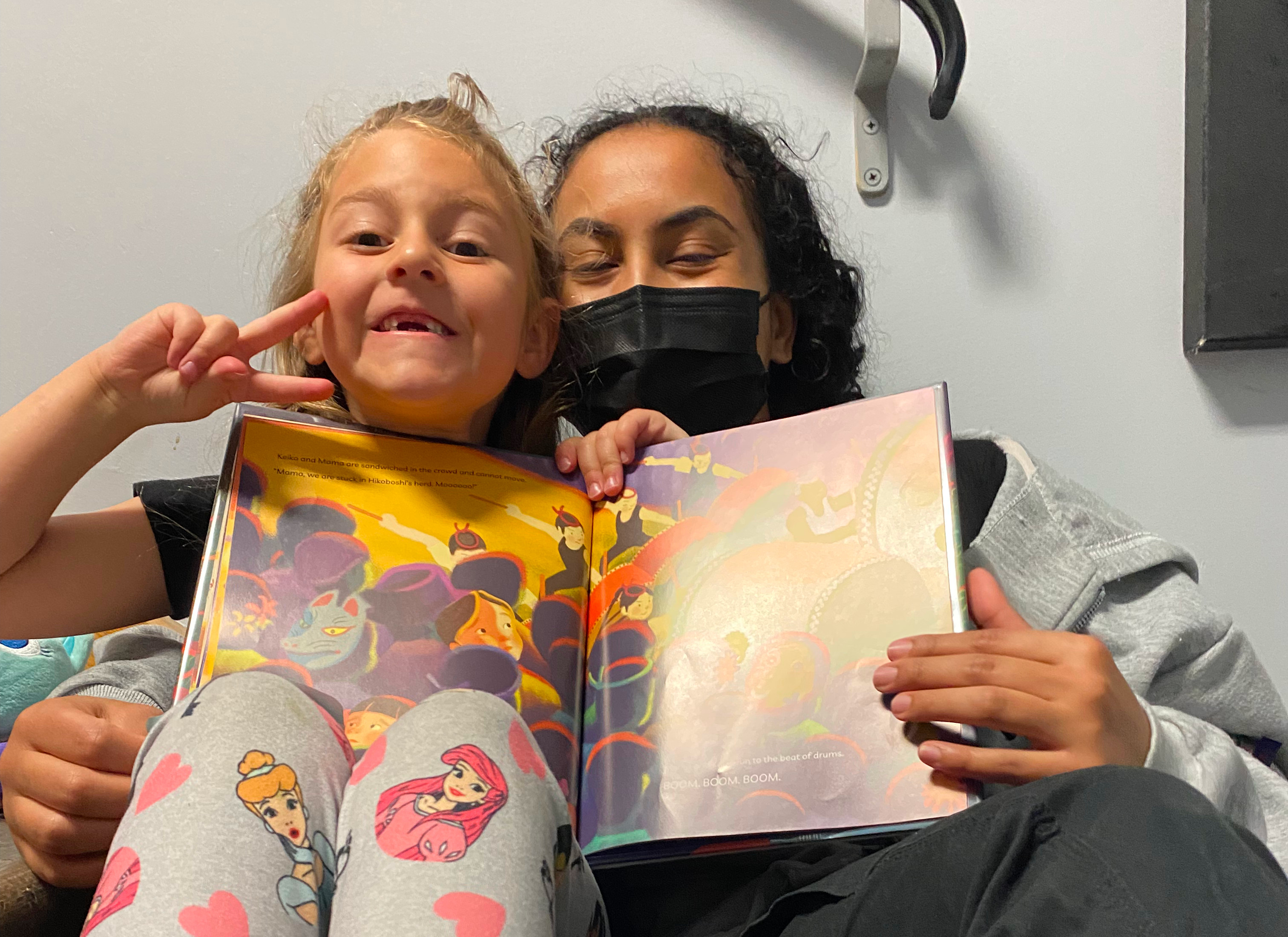 Volunteer and child reading Volunteer and child reading